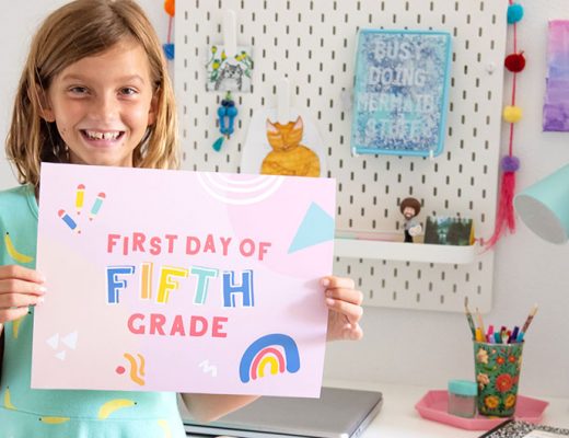 Girl holding first day of school sign. MamiTalks.com